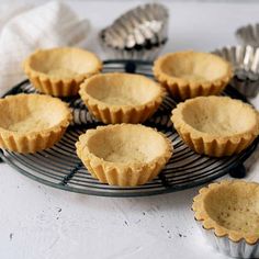 several small pies on a cooling rack