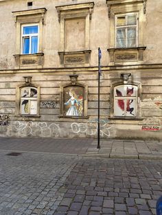 an old building with graffiti on the windows