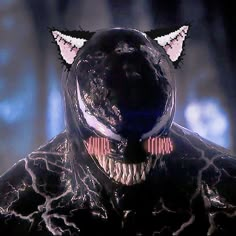 a close up of a person wearing a cat mask