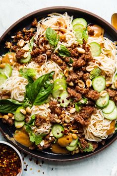 noodles, meat and vegetables are mixed together