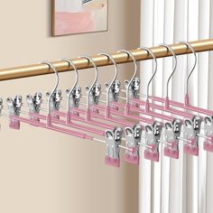 a pink rack with keys hanging from it