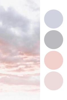 the sky is pink and grey with some clouds in it, as well as three different colors