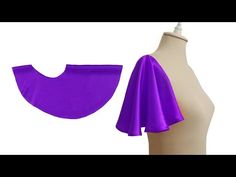 a mannequin with purple fabric on it