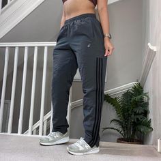 Vintage Adidas loose fit track pants tracksuit bottom cotton lined grey with black stripes Tag says Size M and can be unisex   27" inner leg Seen on size 10uk, 5'4" for reference overall Good condition joggers sportswear trackie track-pant tracksuit bottom sweatpants casual streetwear baggy pants parachute pants y2k 00s gymwear activewear unisex  65 Windbreaker Track Pants, Adidas Vintage, Baggy Pants, Baggy Pant, Vintage Adidas, Casual Streetwear, Gym Wear, Baggy Fits, Black Stripes