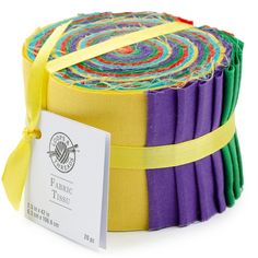 a stack of multicolored fabric with a yellow ribbon around the top and bottom