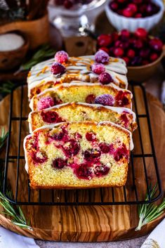 slices of raspberry pound cake on a cooling rack with berries in the background