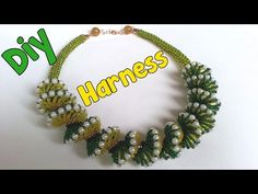 a green and white beaded necklace with words on it that read, diy harnesses