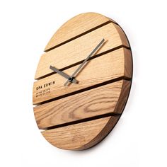 a clock made out of wooden planks on a white background