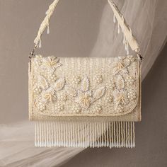 Classic Off-White Embroidered Elegant Bridal Handbag | Handcrafted Purse Bag Perfect for Weddings, Formal Events, And Special Occasions  Take your look to the bold attitude with this embellished clutch. Defined by hand embroidery. Make it the ideal addition to any stand-out style. Width : 7.5 inches Height : 5 Inches Depth : 3 Inches Handmade Clutch. Suitable for every special occasion. Add grace to your dressings. Perfect For Weddings, Parties Etc. These bags can be also used for gift purpose . We welcome wholesale queries and all feedback. White Embellished Clutch Bag, Cream Rectangular Shoulder Bag With Pearl Handle, White Shoulder Evening Bag For Weddings, White Shoulder Evening Bag For Wedding, Embellished Cream Bags For Events, White Shoulder Bag For Wedding, Wedding Shoulder Bag With Pearl Handle, Rectangular, Cream Bags With Pearl Embroidery For Events, White Embroidered Bag For Events