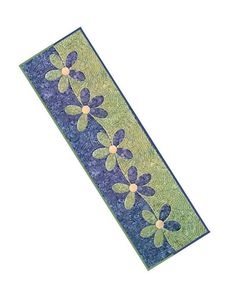 a blue and green ribbon with flowers on it