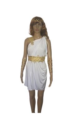 a mannequin wearing a white dress with gold accents on it's chest