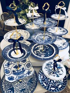 blue and white plates with gold decorations on them