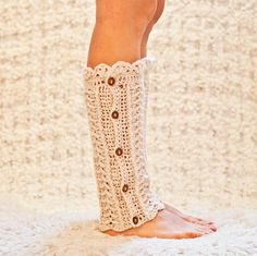 there is a woman's legs with crochet socks on it and her leg in the shape of a boot