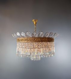 a crystal chandelier hanging from the ceiling