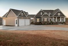 a large house with two garages on top of it