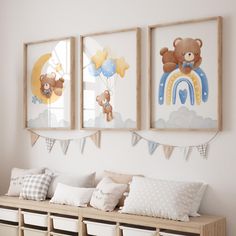 there are three pictures on the wall with teddy bears and rainbows hanging above them