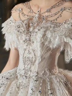 the back of a wedding dress with beading on it