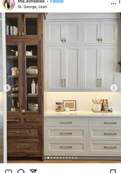 a kitchen with white cabinets and wooden drawers in the middle is featured on instagram