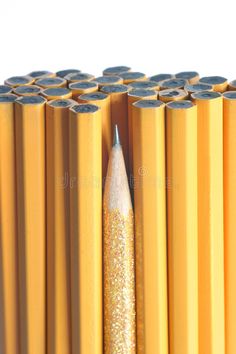 yellow pencils lined up in rows with gold glitter on them royalty images and clippings