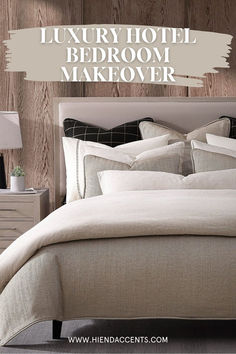 a bed with white linens and pillows in front of a wooden wall that says luxury hotel bedroom makeover