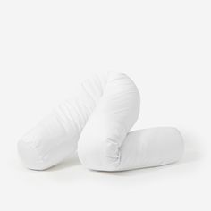 two pillows sitting on top of each other