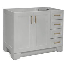 a white bathroom vanity with gold handles on the doors and drawers, against a white background