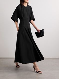 Brandon Maxwell's 'The Darcy' midi dress is modest and elegant, so you'll feel confident wearing it to a number of occasions. Cut from black cotton, it has wide sleeves and a smooth, fitted panel at the hips before falling to a full skirt. Slim cutouts along the neck and back reveal just a glimpse of skin. Modern Black Maxi Dress For Work, Modern Formal Maxi Dress, Luxury Black Midi Evening Dress, Luxury Black Midi Dress, Modern Black Midi Dress For Formal Occasions, Bridesmaid Dress Long Sleeve, Black Work Dress, Black Bridesmaid Dress, Long Sleeve Bridesmaid Dress