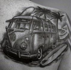 a man with a tattoo on his back has a vw bus and palm trees