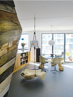 a living room filled with furniture and lots of windows