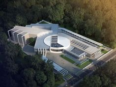 an aerial view of a building surrounded by trees