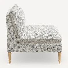 an upholstered chaise lounge chair with floral fabric