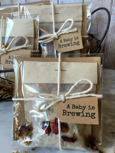 small bags filled with baby's brewing tea and dried herbs tied to twine