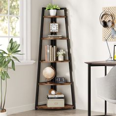 a corner shelf with books on it next to a desk and chair in a room