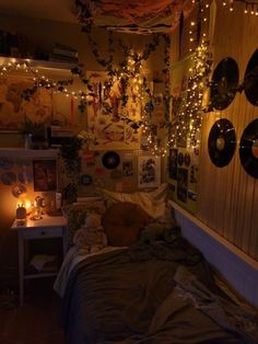 a bedroom with lights strung from the ceiling