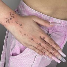 a woman's hand with stars on it