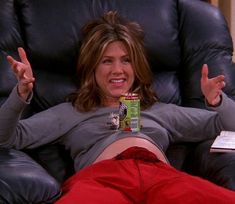 an image of a woman laying on the couch with her legs spread out and pointing