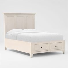 a bed with two drawers underneath it and a white headboard on the bottom side