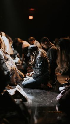 a group of people sitting on the ground