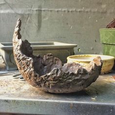 an old toothbrush sitting on top of a table next to other tools and containers