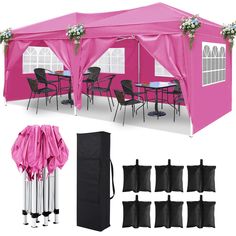 a pink tent with black chairs and tables