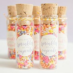 three jars filled with sprinkles and confetti on top of each other