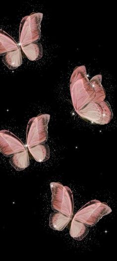 three pink butterflies are flying in the dark sky with sparkles on it's wings