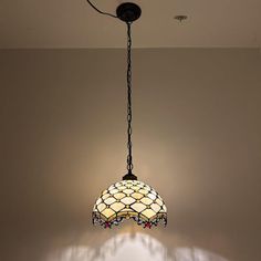 a lamp hanging from the ceiling in a room