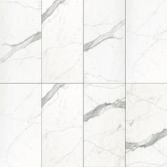 white marble tiles with grey veining on the edges and bottom, all lined up in rows