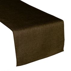 a brown table runner on top of a white surface with a black cloth over it