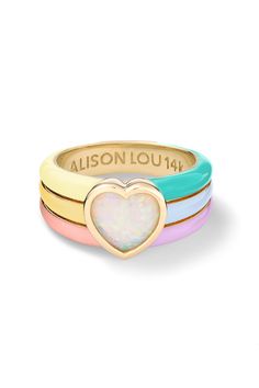 Show your love with this funky and groovy statement. Features a heart-shaped opal with multicolor enamel. Unique Jewelry Rings, Playful Multicolor Jewelry With Heart Charm, Trendy Multicolor Heart-shaped Jewelry, Playful Multicolor Heart Charm Jewelry, Playful Multicolor Heart-shaped Jewelry, Multicolor Enamel Heart-shaped Jewelry, Multicolor Enamel Heart Jewelry, Multicolor Heart-shaped Enamel Jewelry, Trendy Colorful Heart-shaped Jewelry