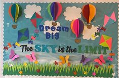 the sky is the limit bulletin board with paper hot air balloons and butterflies on it