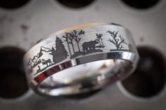 a ring with an animal scene on it