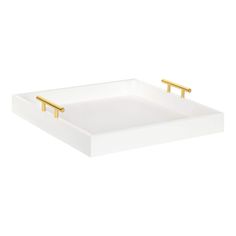 a white tray with two gold handles on the bottom and one in the middle,