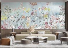 a living room with flowers painted on the wall